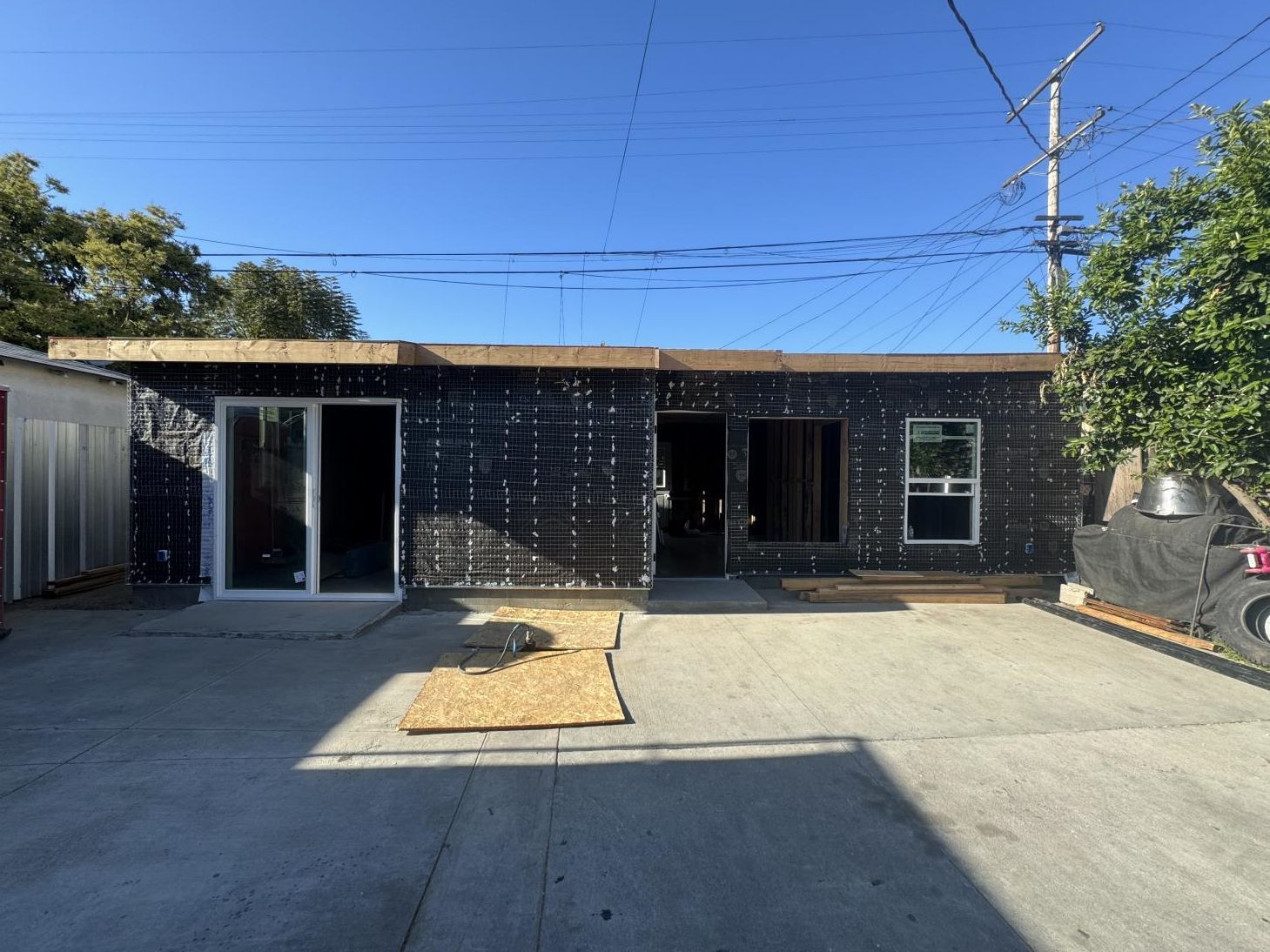 the front of a house with a white garage door