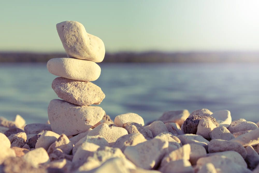 Pile Of Stones On The Beach — Prepaid Funerals in The Entrance, NSW
