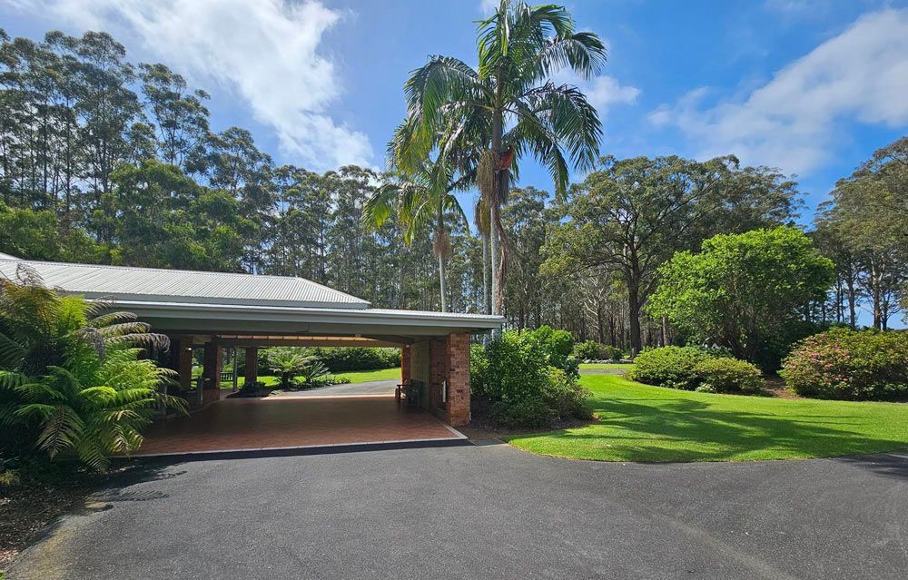 A Driveway With A Covered Garage