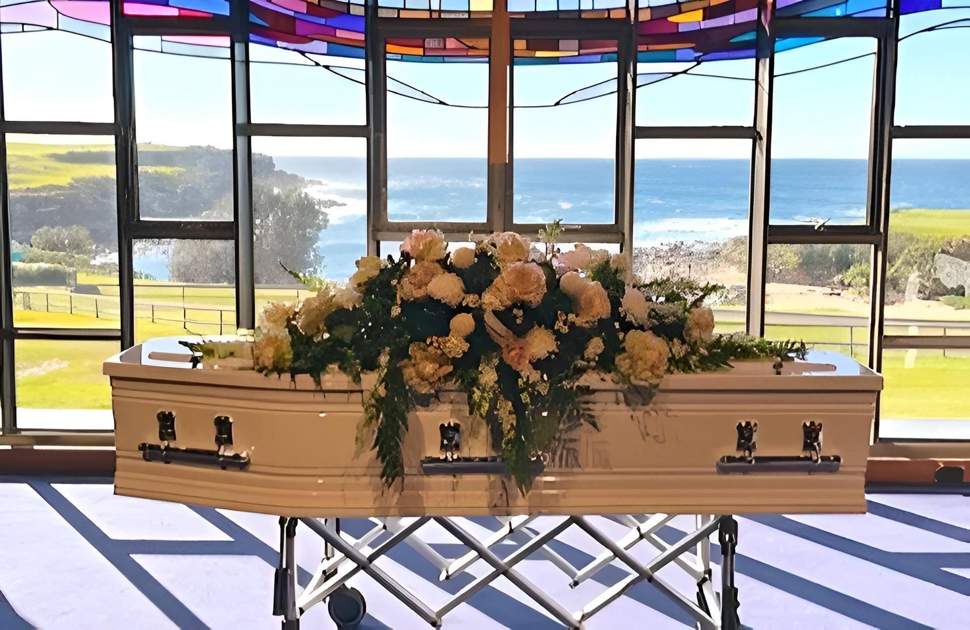 Casket With Floral Arrangement