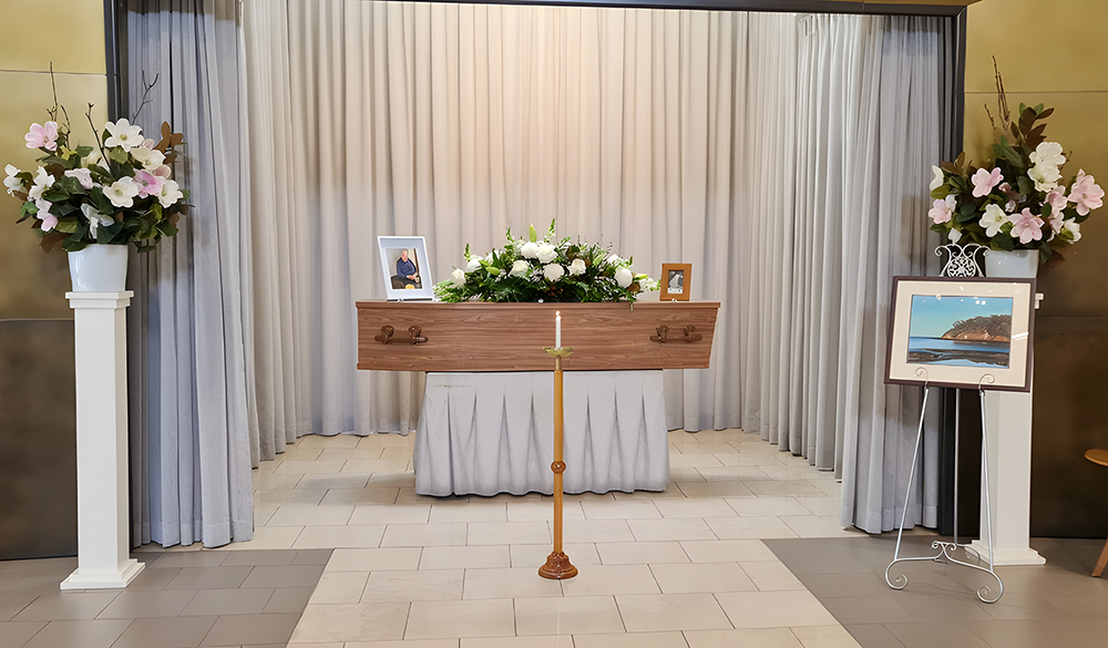Coffin Surrounded by Flowers