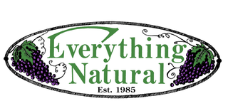 A logo for everything natural with purple grapes and green leaves