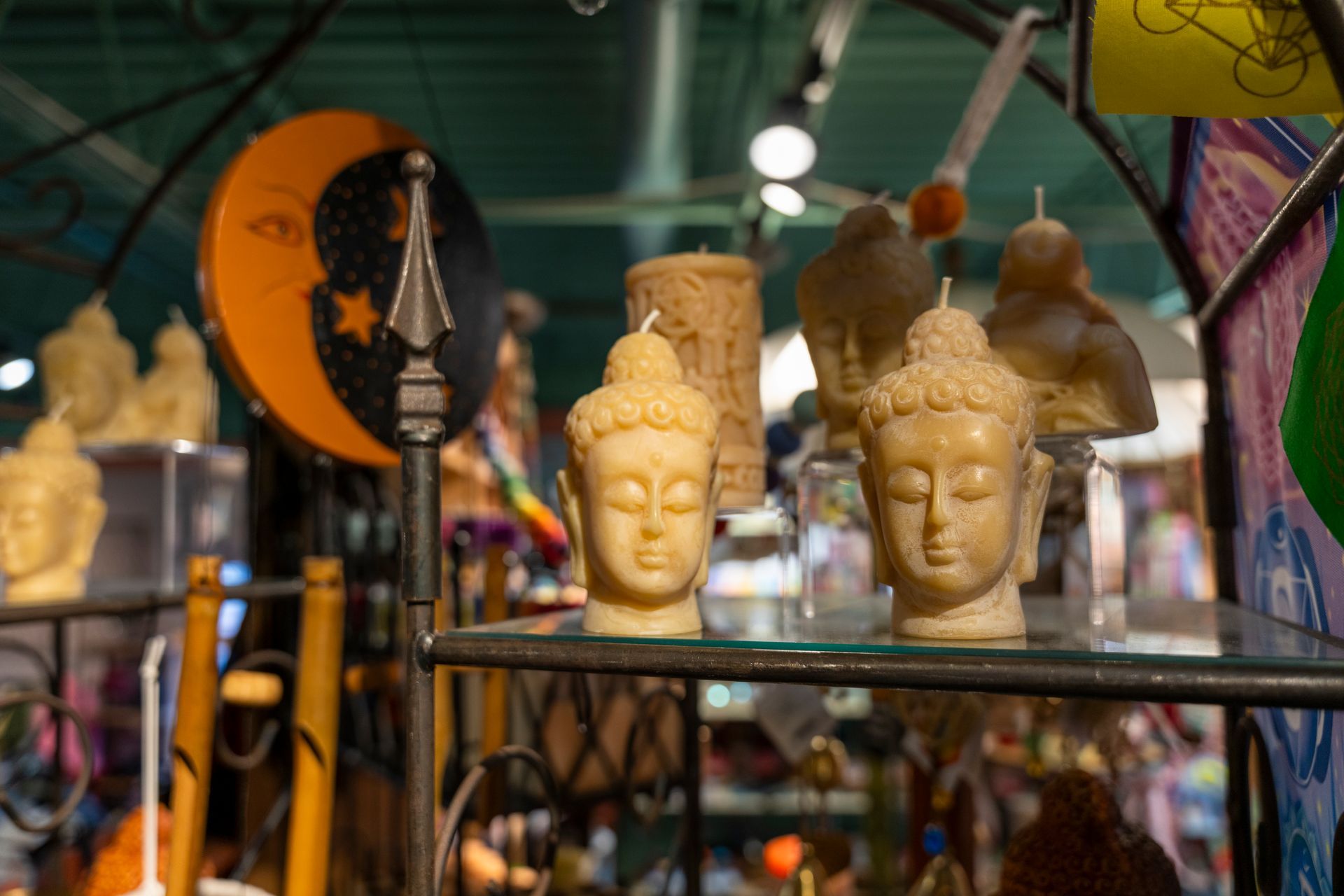Shelves filled with statues, figurines and candles.