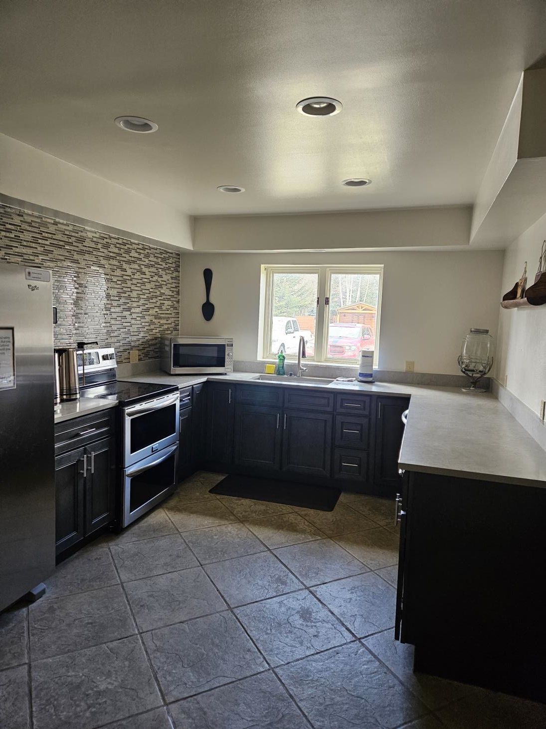 a kitchen with blue and white cabinets.