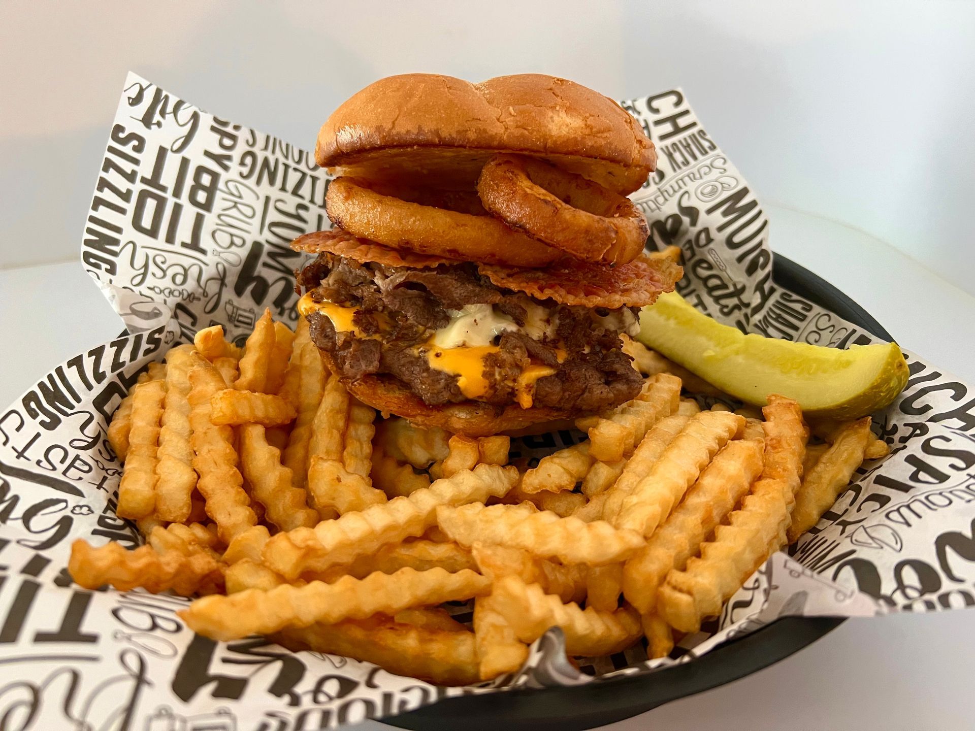 A sunset over a mountain range with a lot of fog