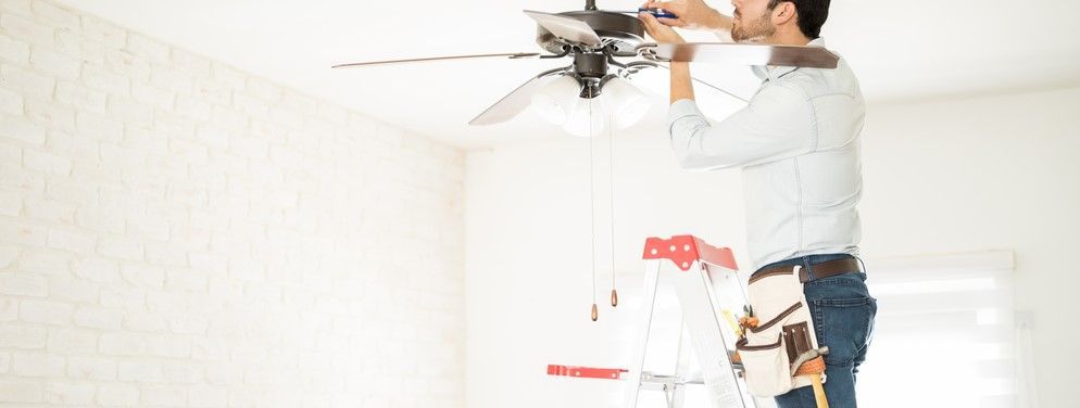 A Man Installing a Ceiling Fan — Fishkill, NY — Burke Services