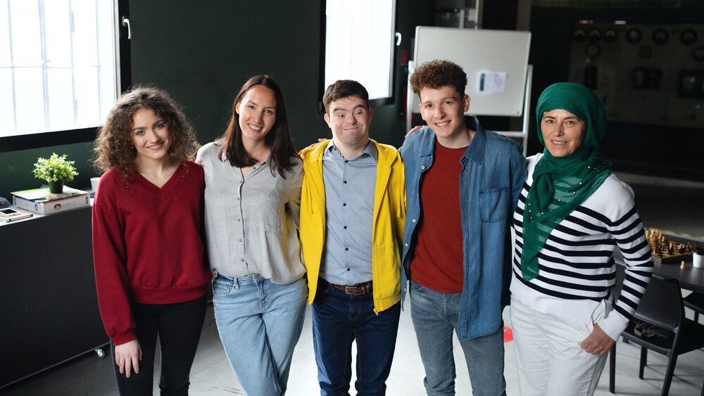 A Group of Young People Are Posing for a Picture Together in a Room — Empowering You Disability Services in Maryborough, QLD