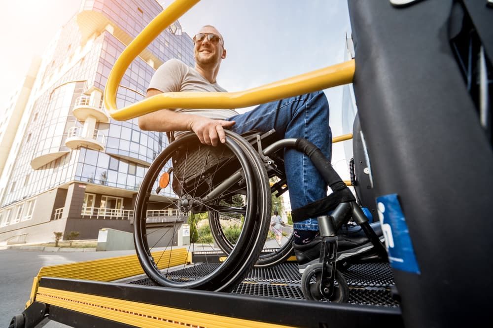 A Man in a Wheelchair is Sitting on a Ramp — Empowering You Disability Services In Maryborough, QLD
