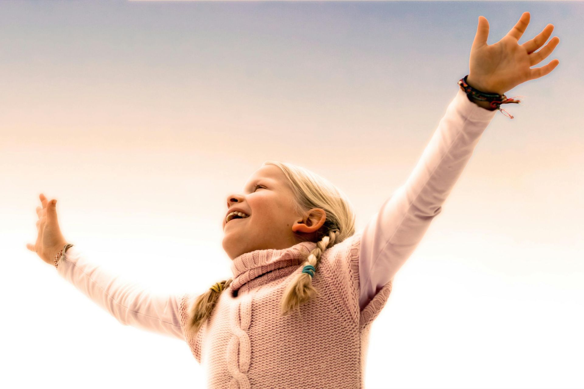 A young girl with her hands in the air — Empowering You Disability Services In Maryborough, QLD