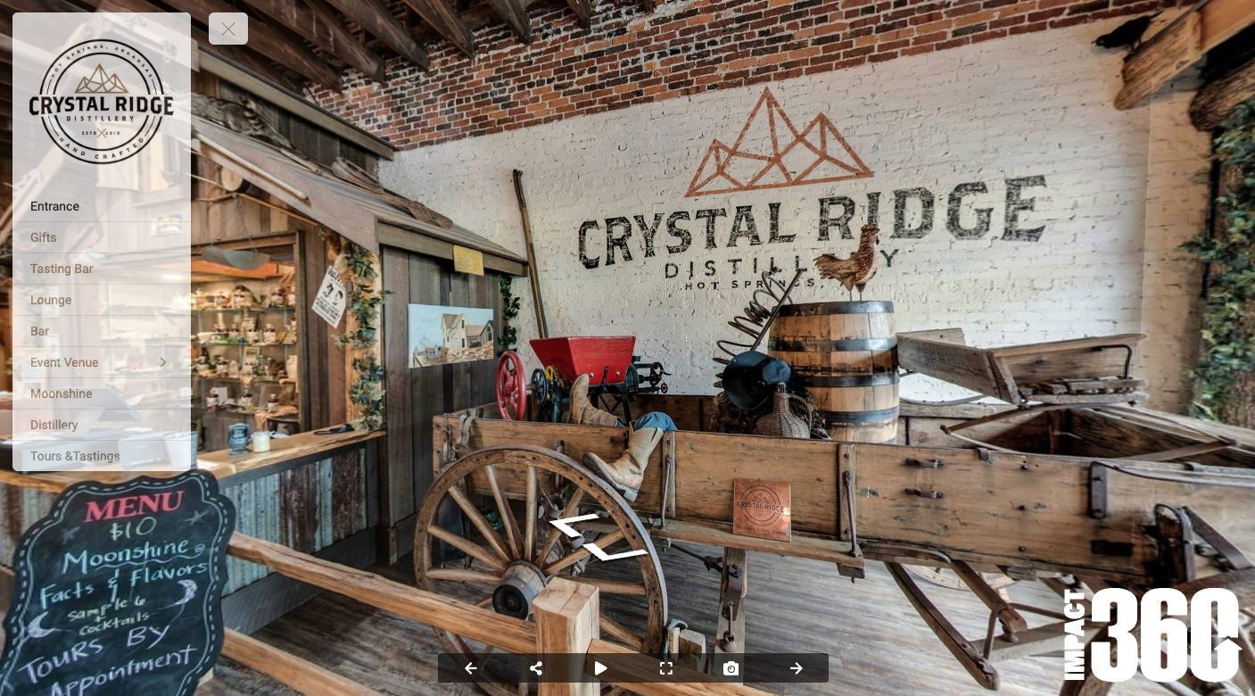 a virtual tour of crystal ridge distillery with a horse drawn carriage in the foreground .