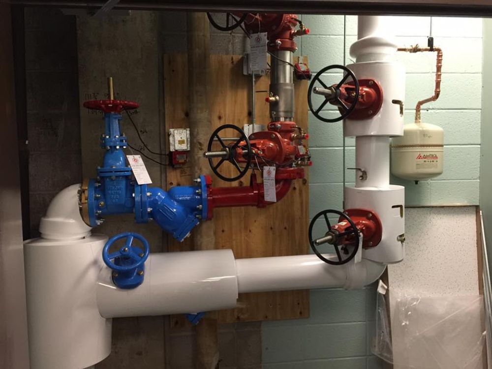 A room with a lot of pipes and valves on it