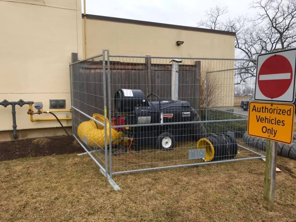A fence with a sign that says authorized vehicles only