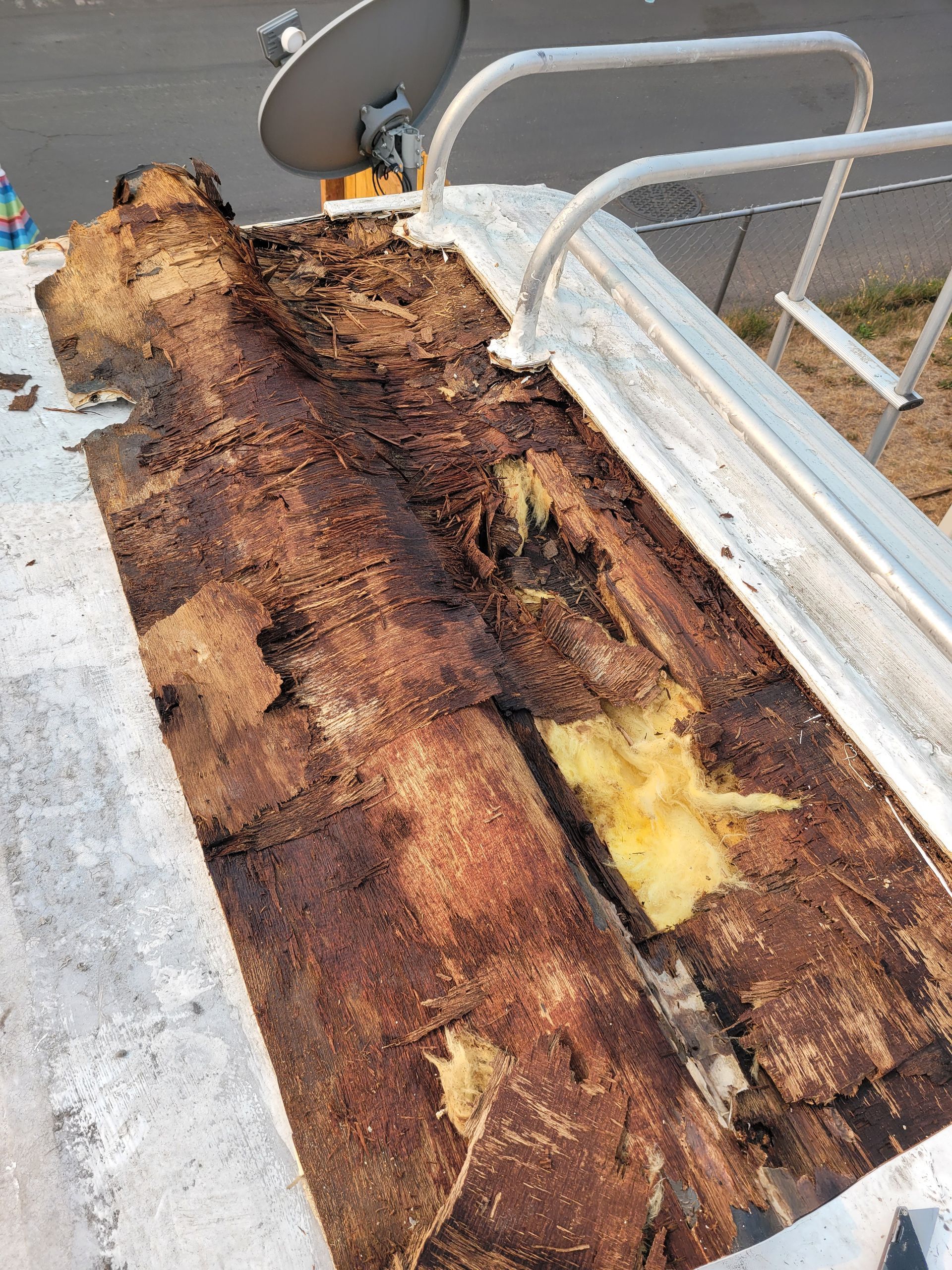 A piece of wood is laying on top of a concrete surface.
