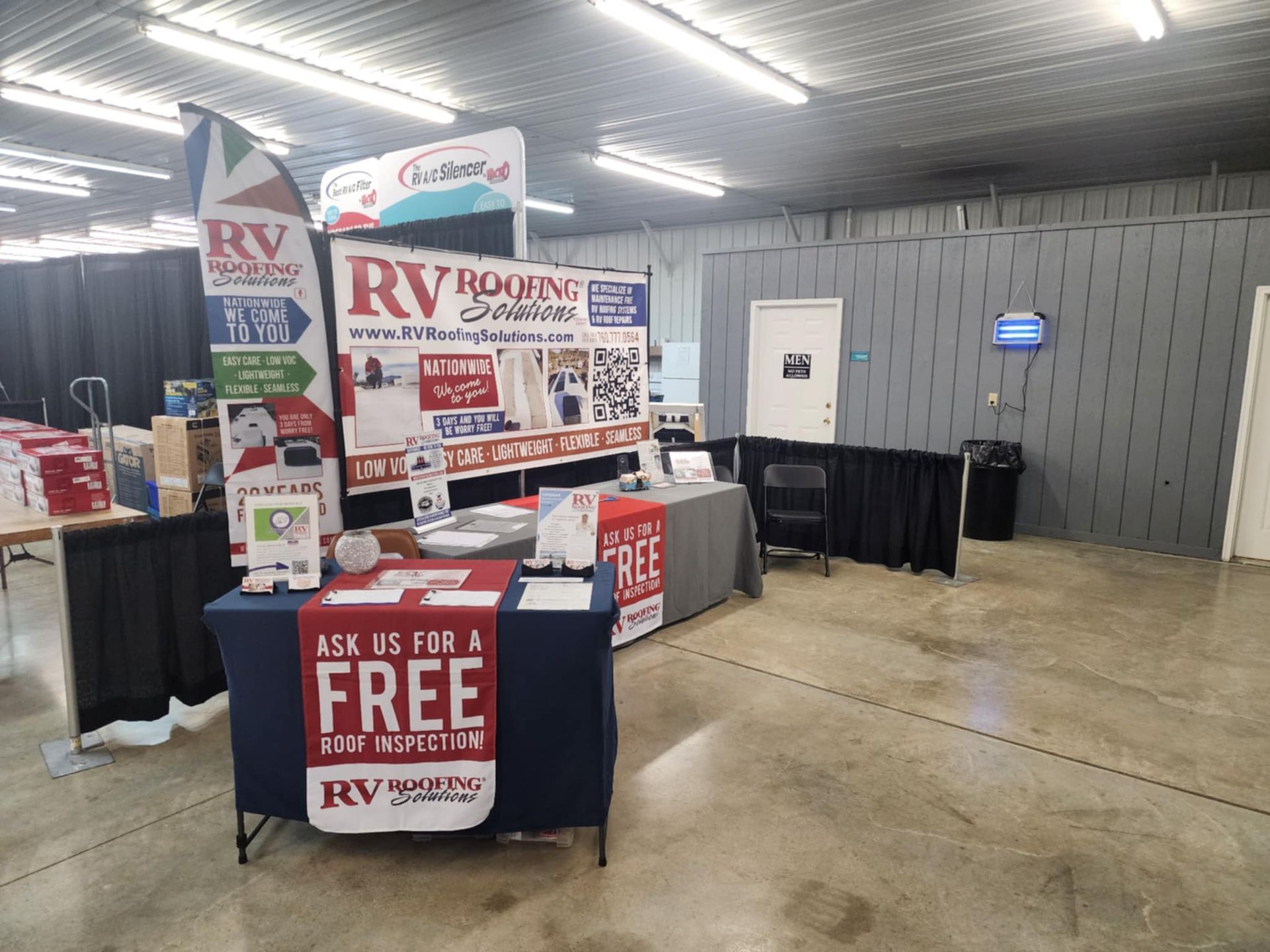 A table with a sign that says `` ask us for a free rv rental ''