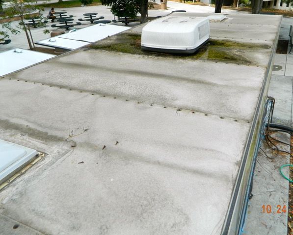 old rv roof with repairs