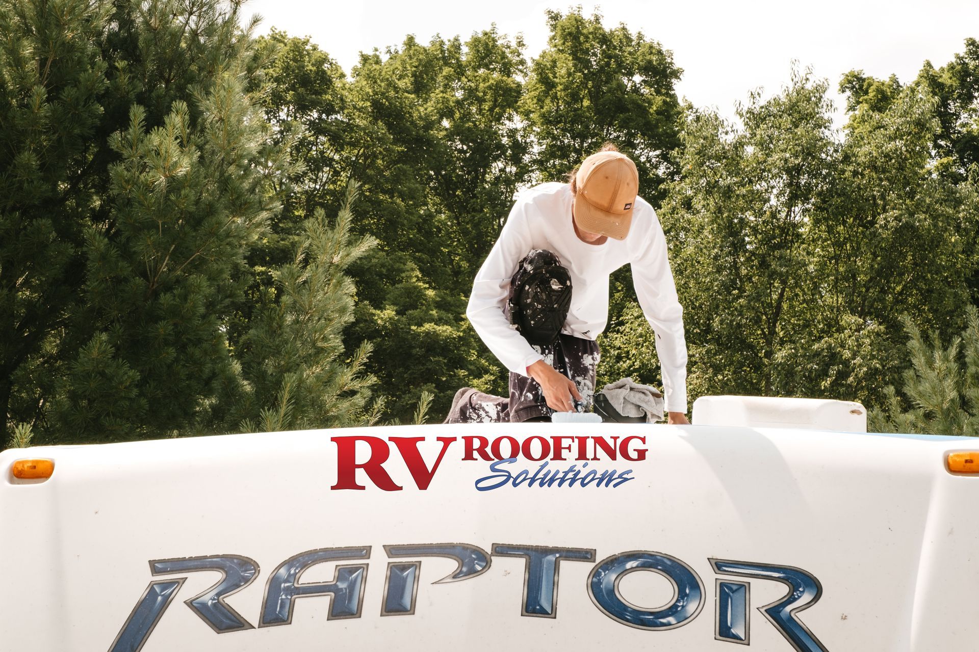 Person working on an RV roof with