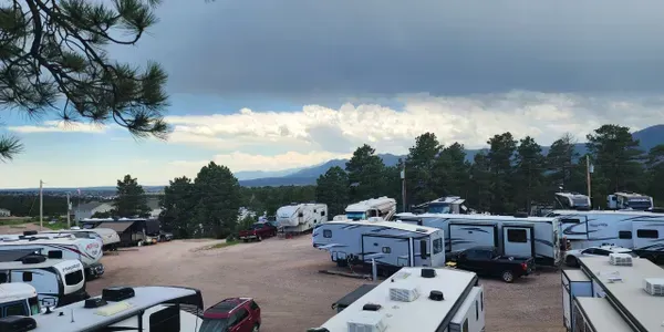 A lot of rvs are parked in an rv park  with mountains in the background. Lake Havasu AZ