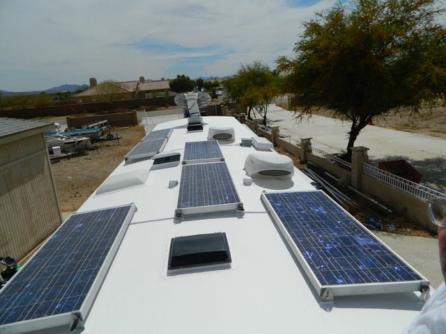 A roof with a lot of solar panels on it