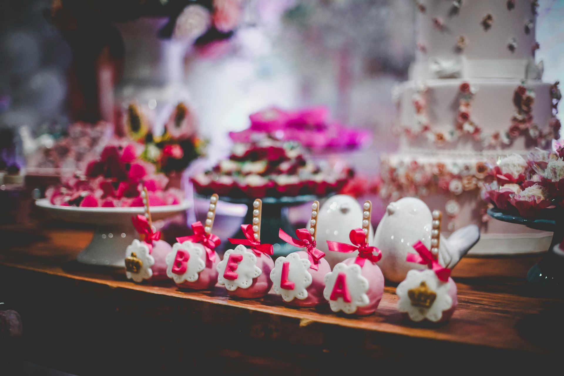 A table topped with a variety of desserts and a cake.