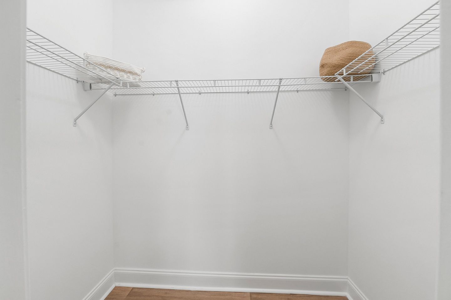 Empty closet with white wire shelving