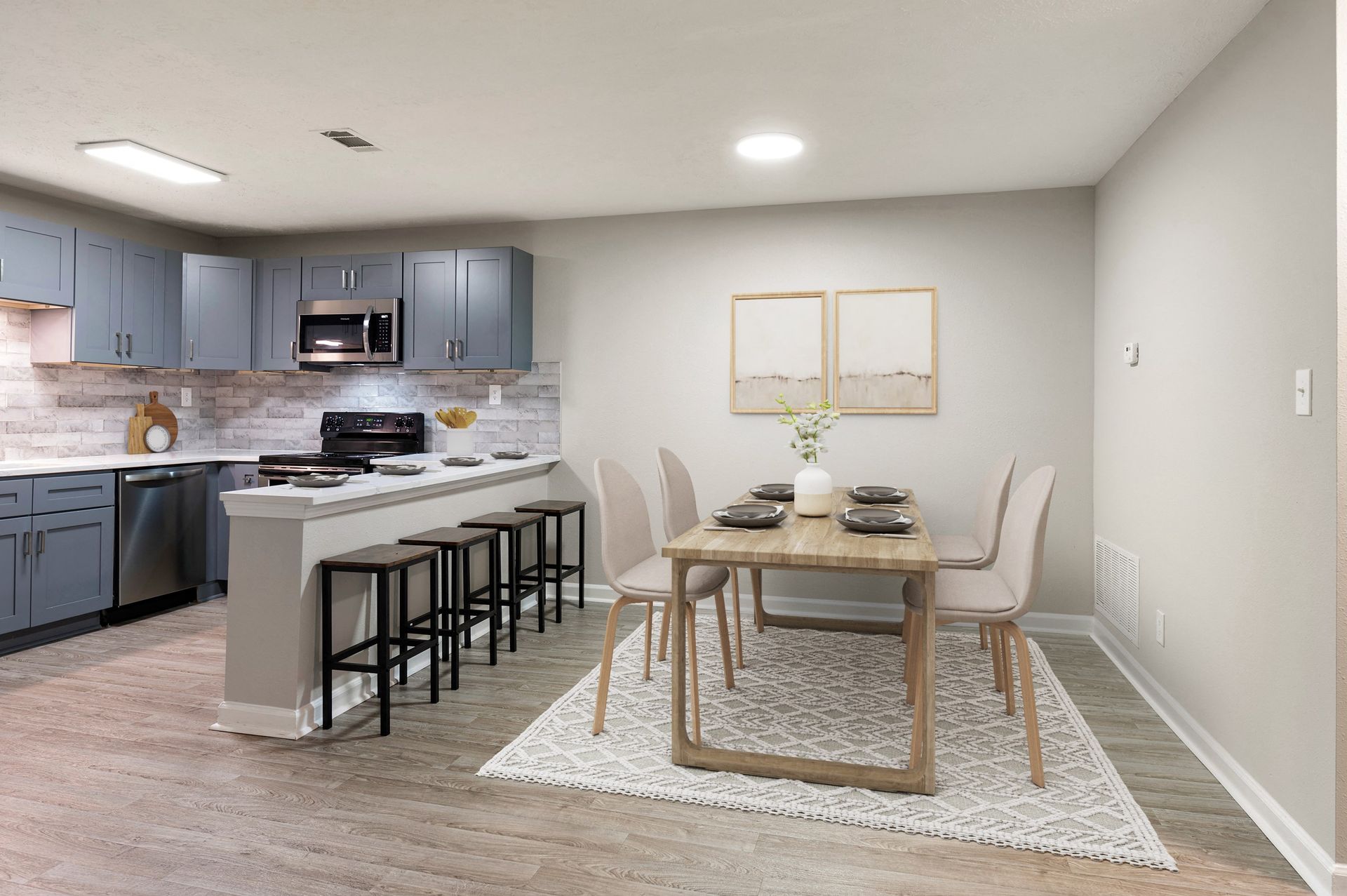 Modern kitchen and dining area with wooden table and chairs