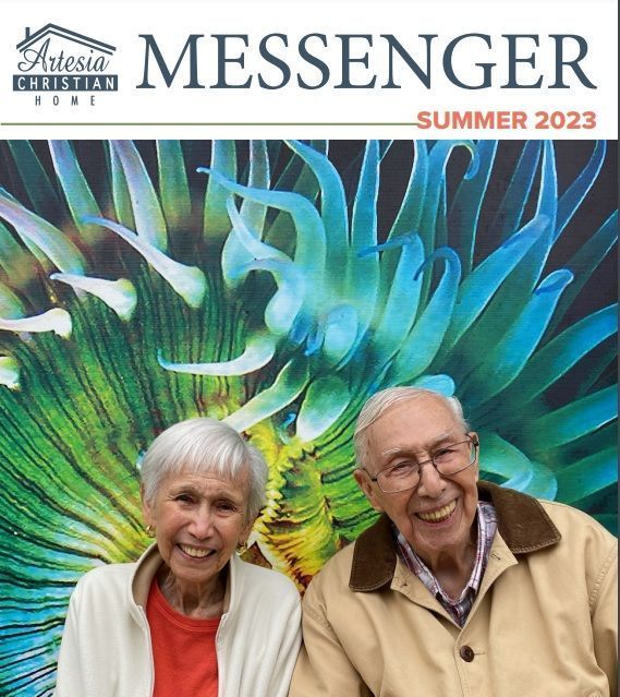 Artesia Christian Home Messenger Summer 2023 cover: Smiling elderly couple in front of colorful, blurry plant background.