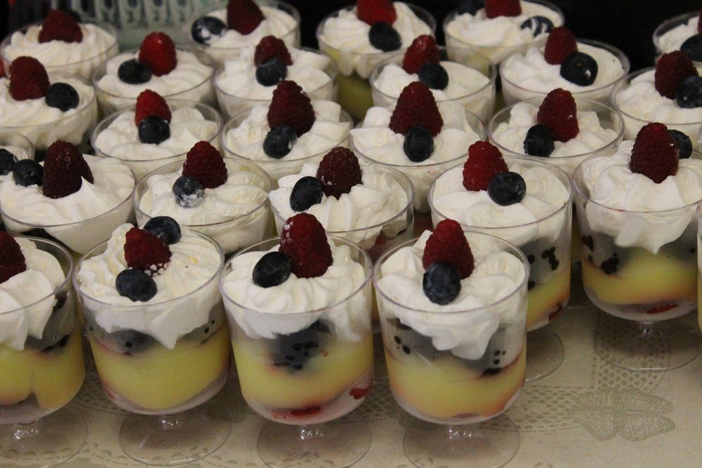 Fruit parfaits with whipped cream.