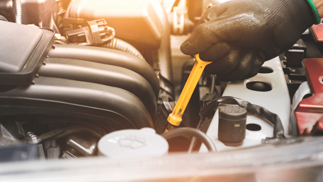 mechanic doing an oil check