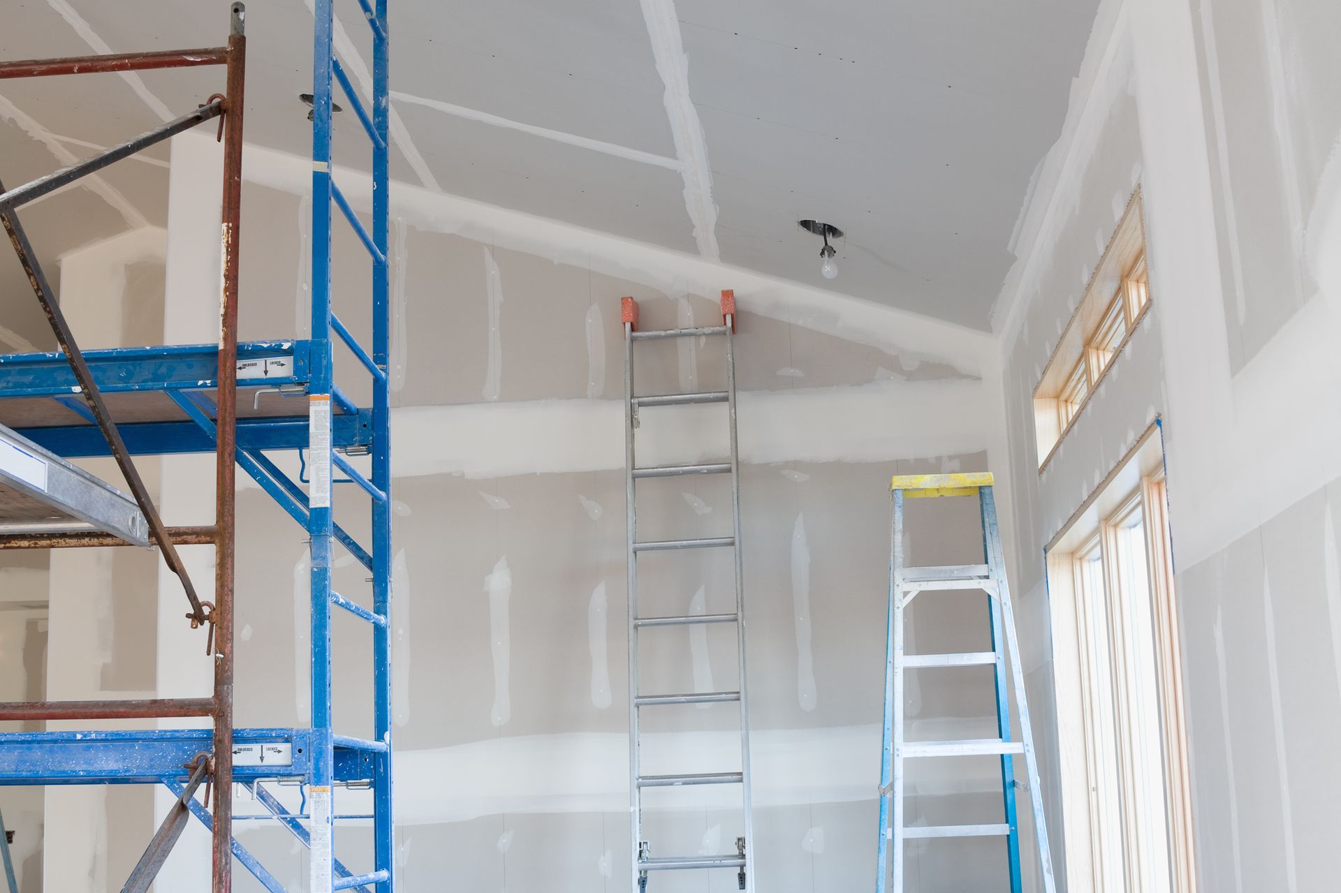 A room with a ladder and scaffolding in it