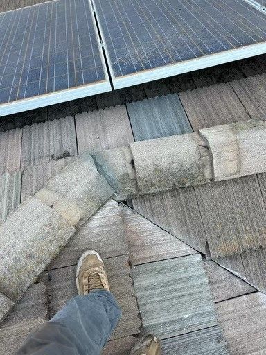 A person is standing on a roof with solar panels — Rio Linda, CA — M1 Roofing