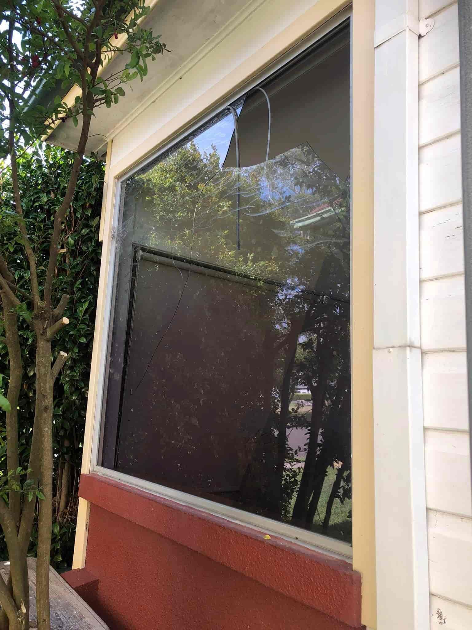 A Large Window on the Side of a House With Trees Reflected in It — Pelican Glass in Lake Macquarie, NSW