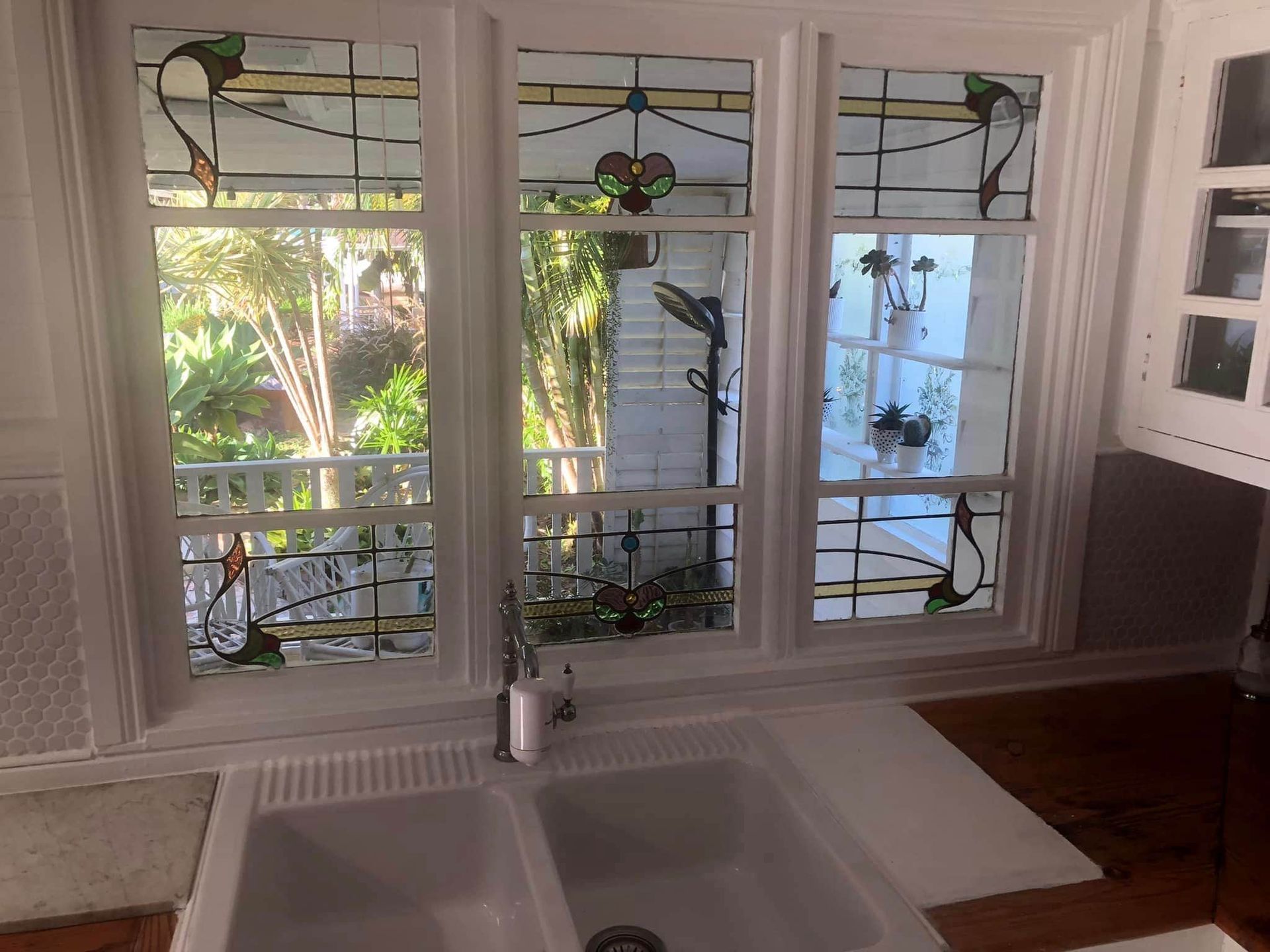 A Kitchen With Two Sinks and Stained Glass Windows — Pelican Glass in Warners Bay, NSW