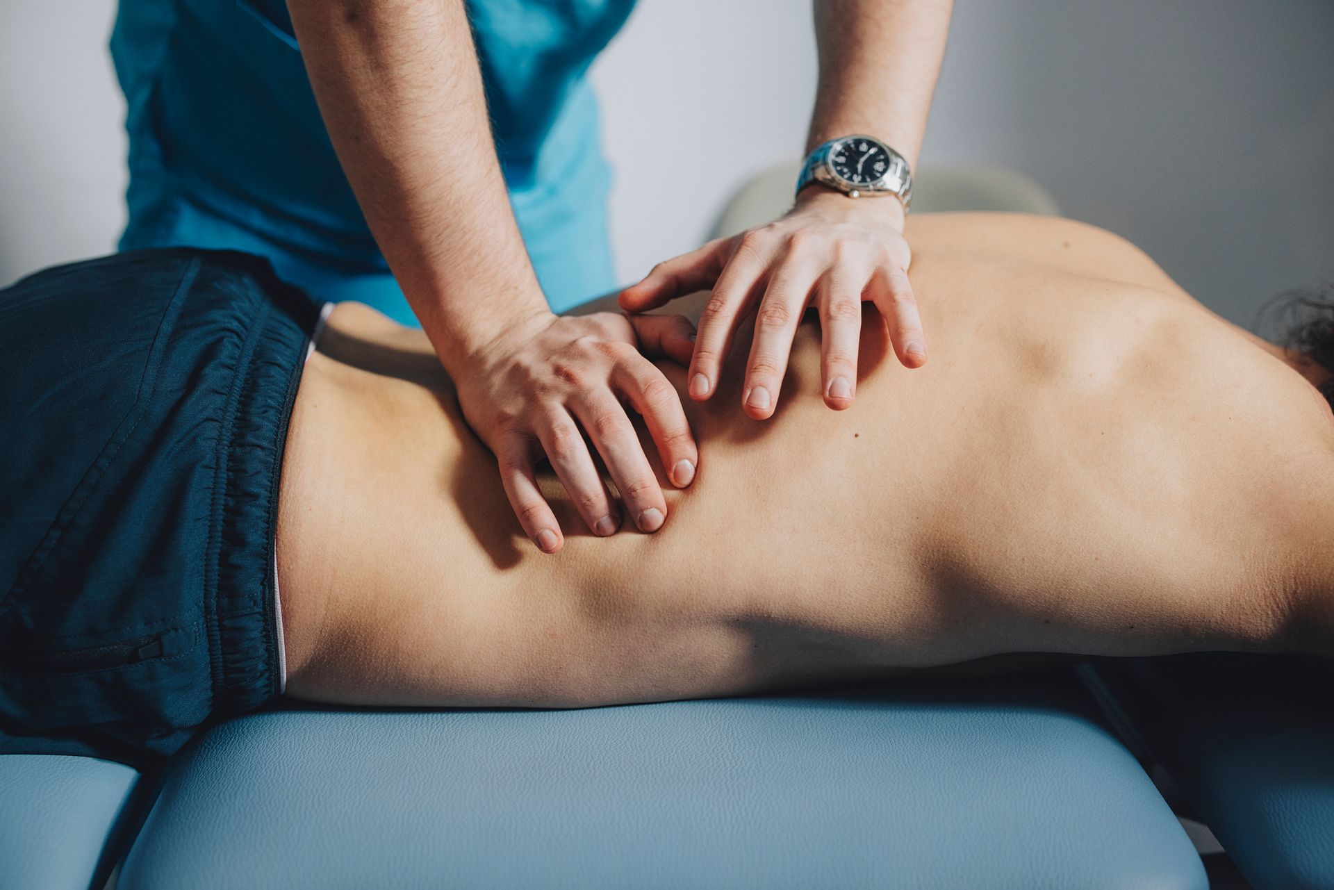 Sports Massage — Physiotherapist Giving Knee Therapy To A Woman in Monroeville, PA
