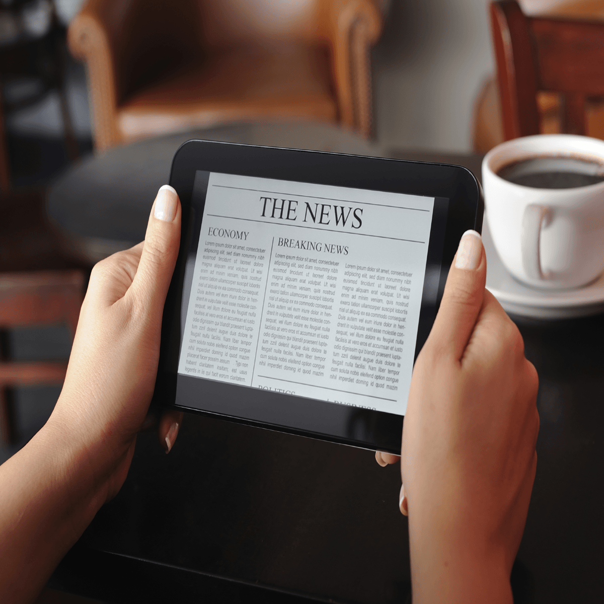 A person is reading the news on a tablet