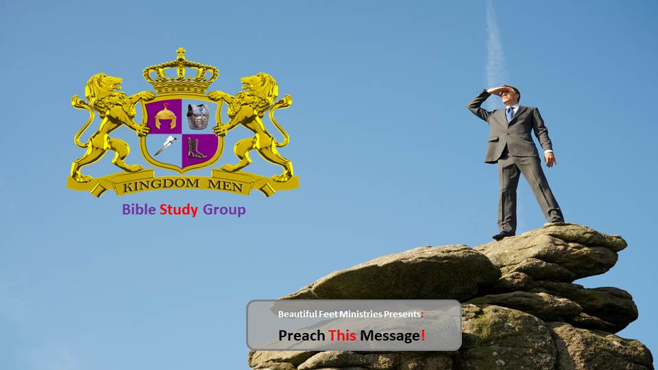 A man in a suit is standing on top of a rocky hill.