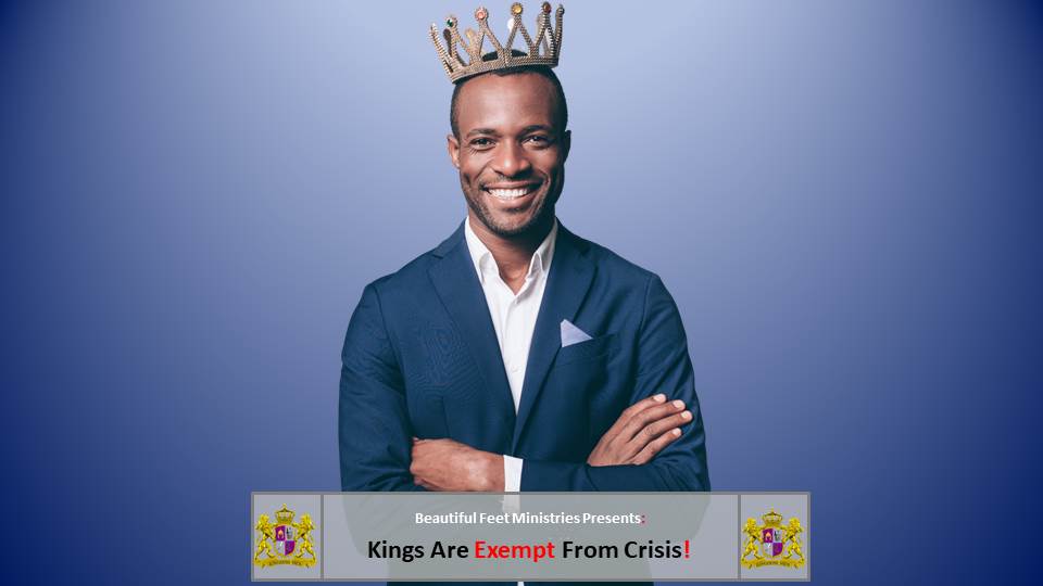A man in a suit is wearing a crown on his head.