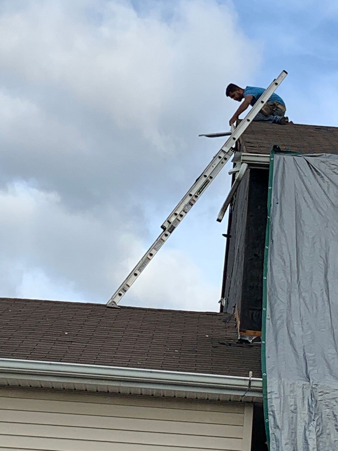 Worker Repairs Roof — Burlington, NJ — AD Roofer Siding & Gutters