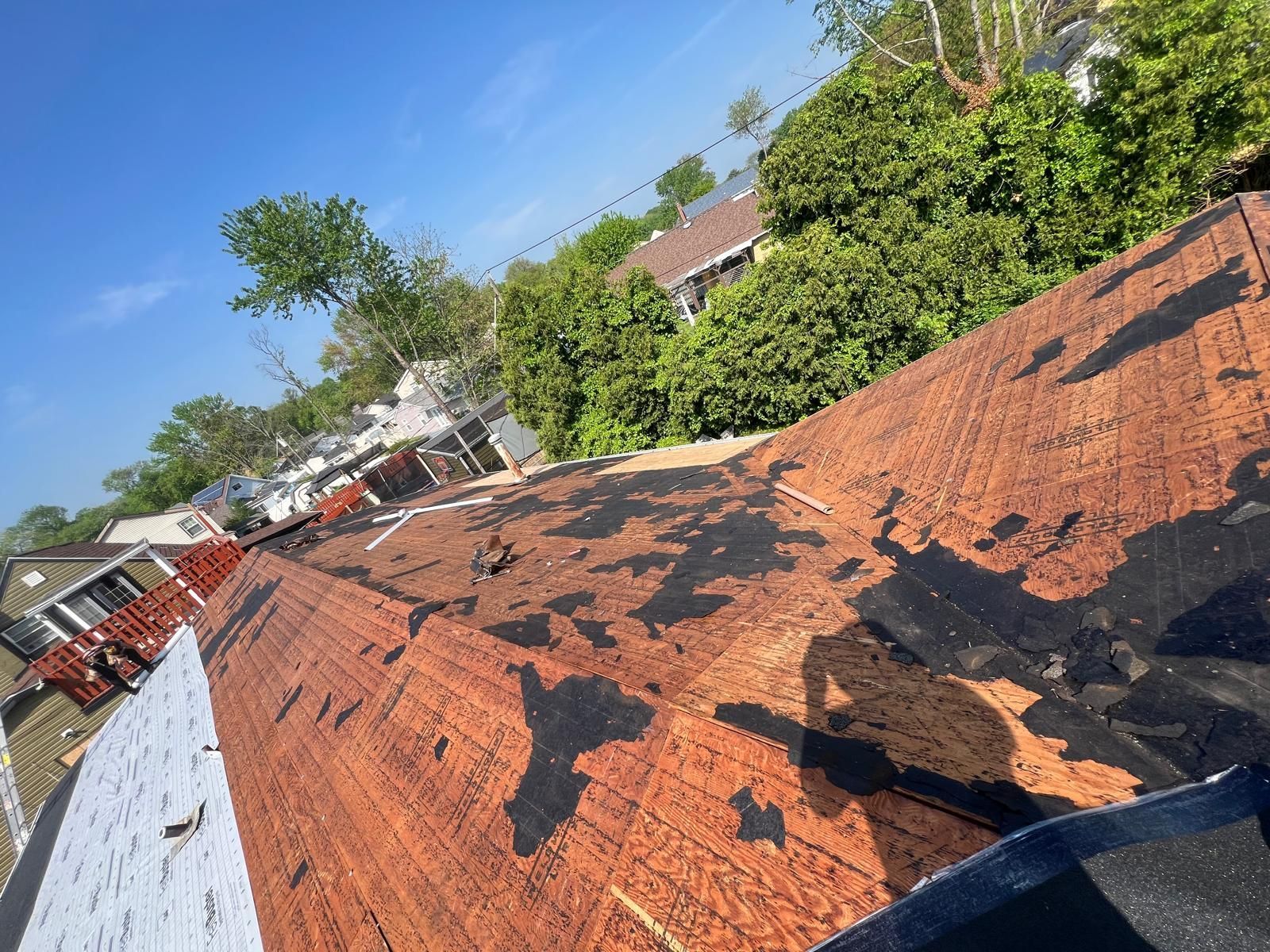 A Roof With a Lot of Shingles on It Is Being Repaired — Burlington, NJ — AD Roofer Siding & Gutters