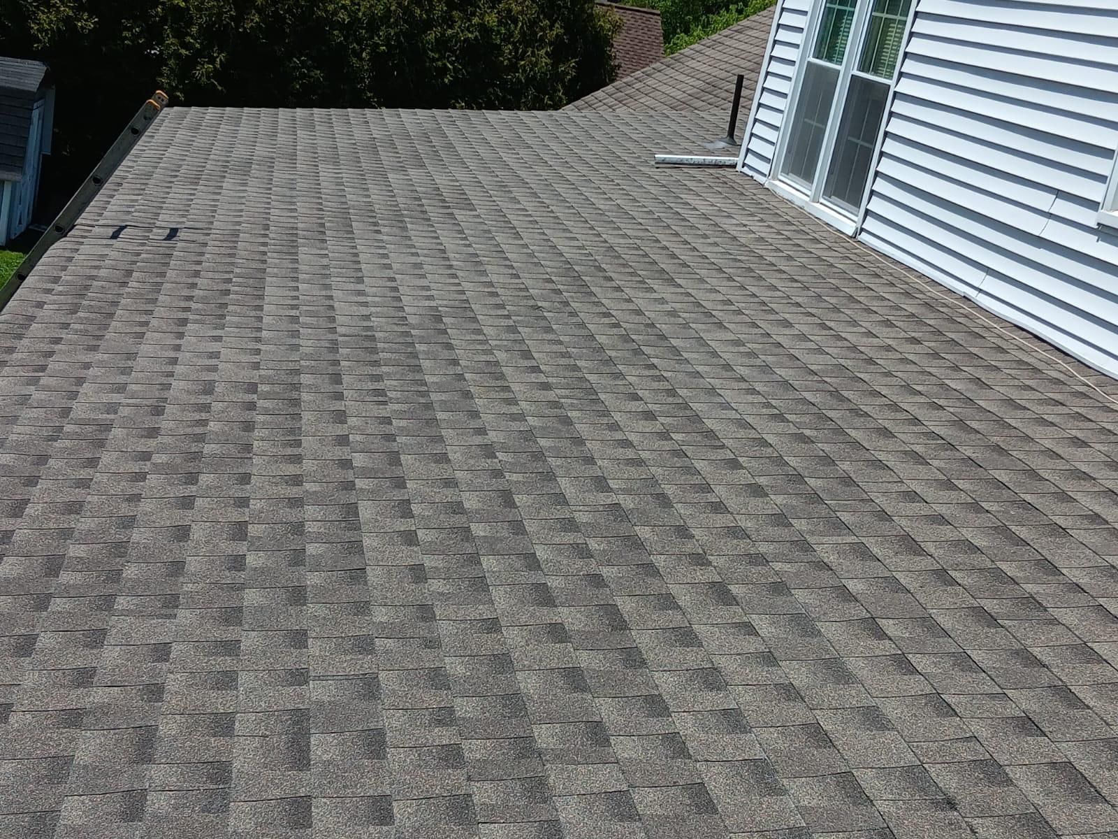 A Roof of a House With a Lot of Shingles on It — Burlington, NJ — AD Roofer Siding & Gutters