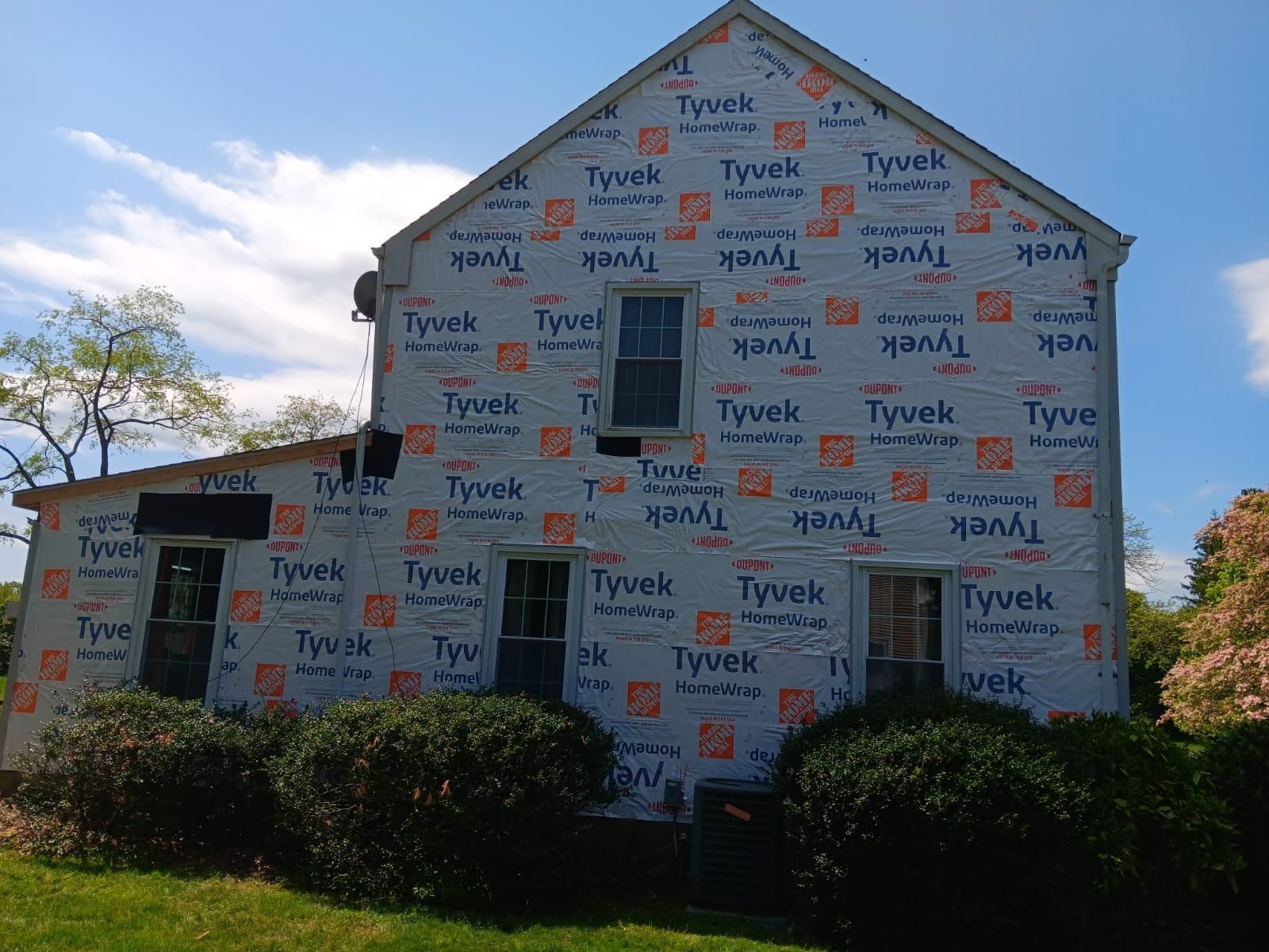 A House Is Covered in Tyvek Insulation — Burlington, NJ — AD Roofer Siding & Gutters