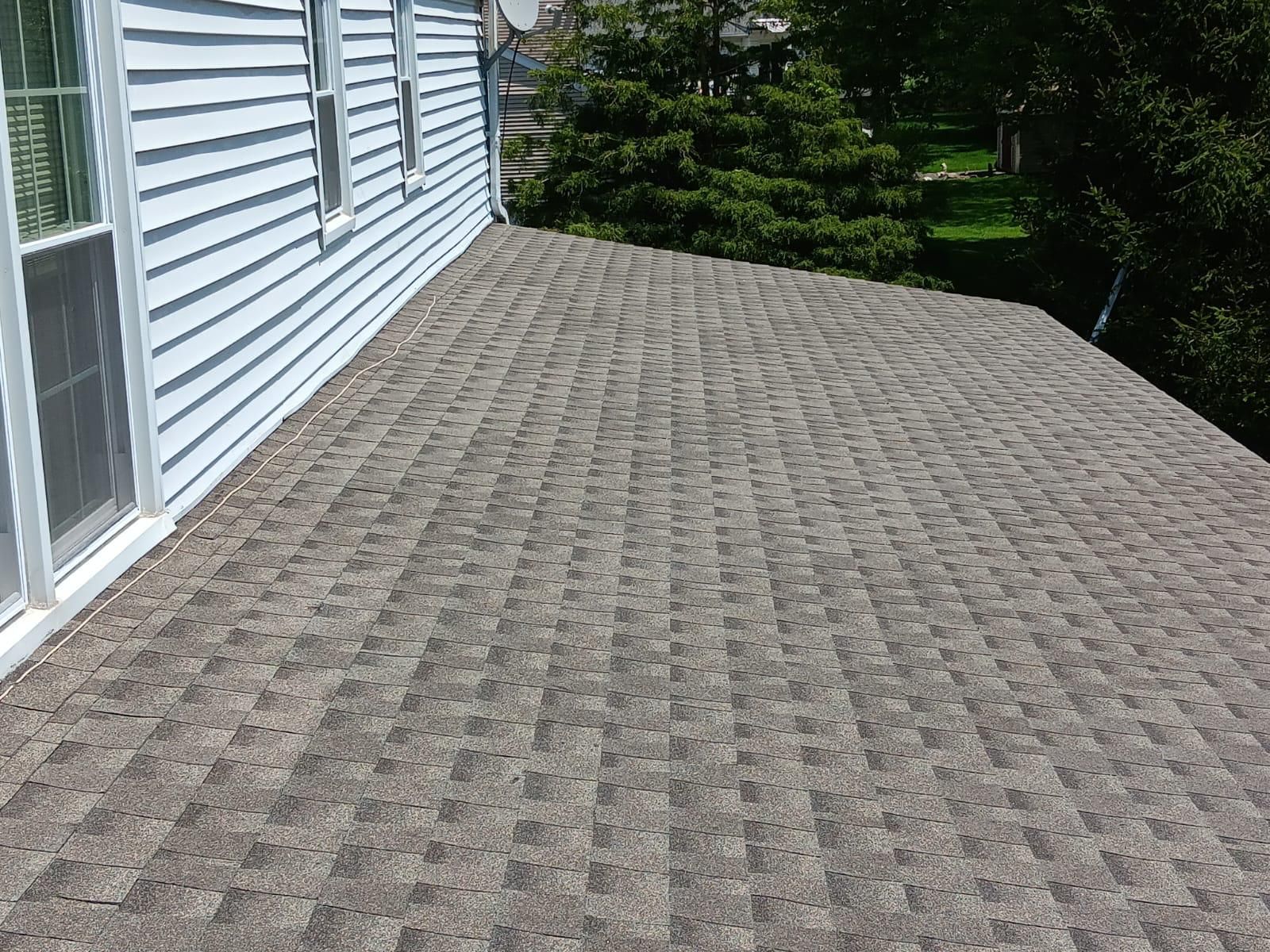 A Roof of a House With a Gray Shingle Roof — Burlington, NJ — AD Roofer Siding & Gutters
