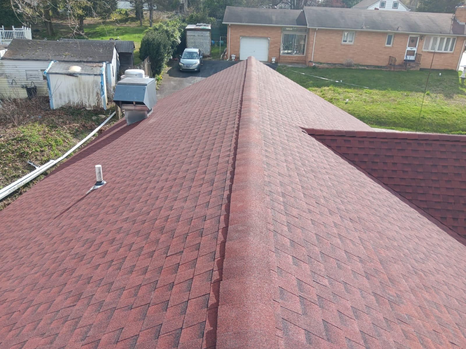 The Roof of a House Has a Red Shingle Roof — Burlington, NJ — AD Roofer Siding & Gutters