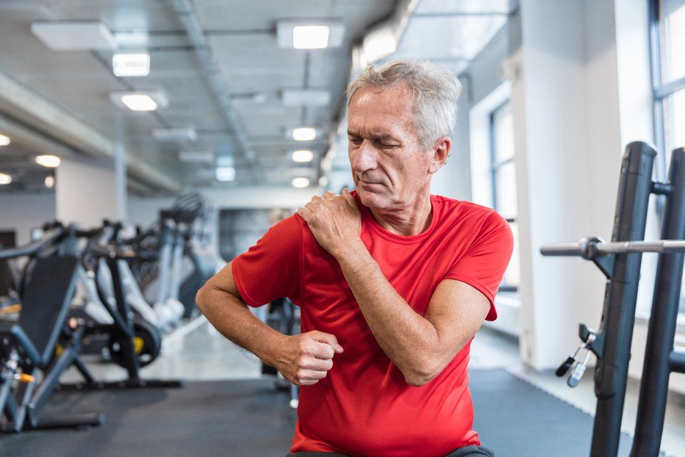 Old Man With Shoulder Pain — Tavernier, FL — Garrett Chiropractic & Wellness Center