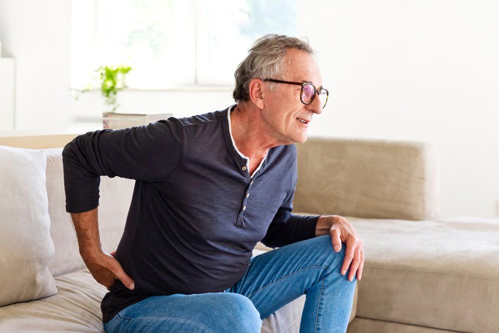 Old Man With Back Pain — Tavernier, FL — Garrett Chiropractic & Wellness Center