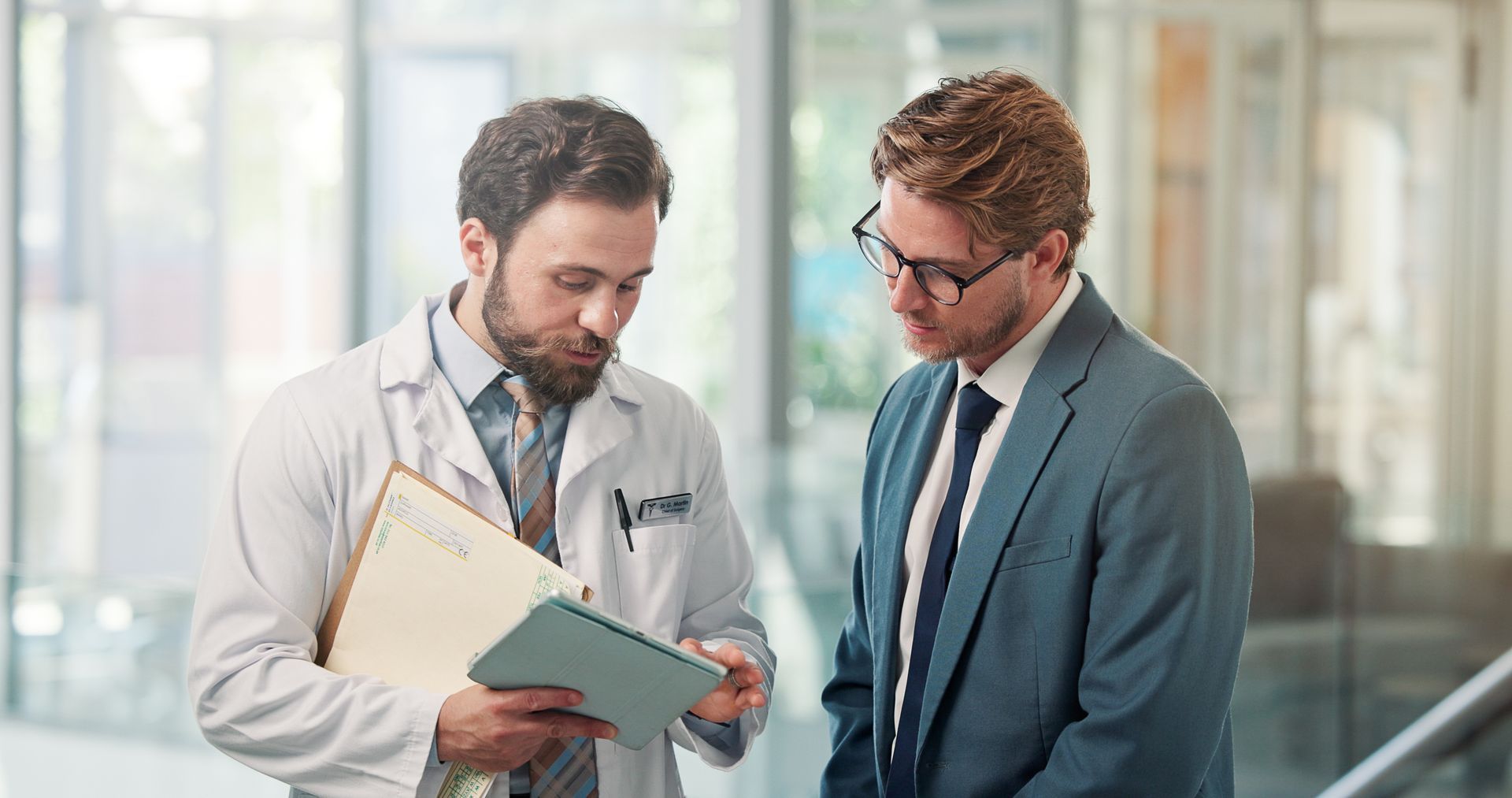 A man is talking with a healthcare advocate.