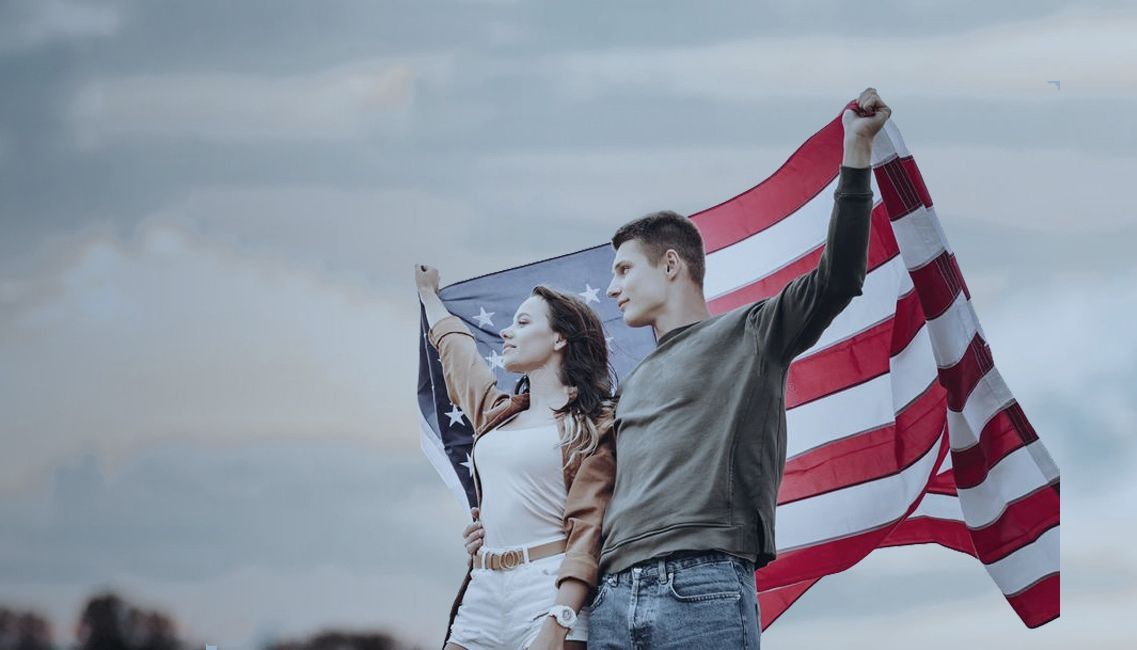 Young Couple Holding USA Flag