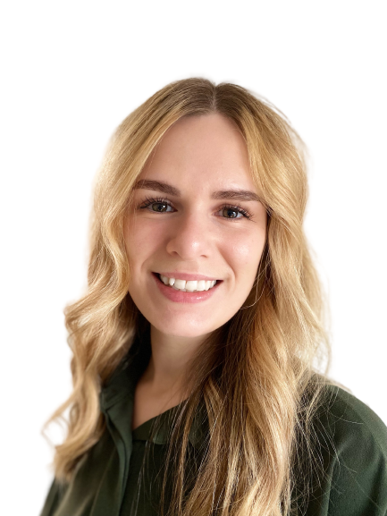 The woman is wearing a green shirt and smiling for the camera.