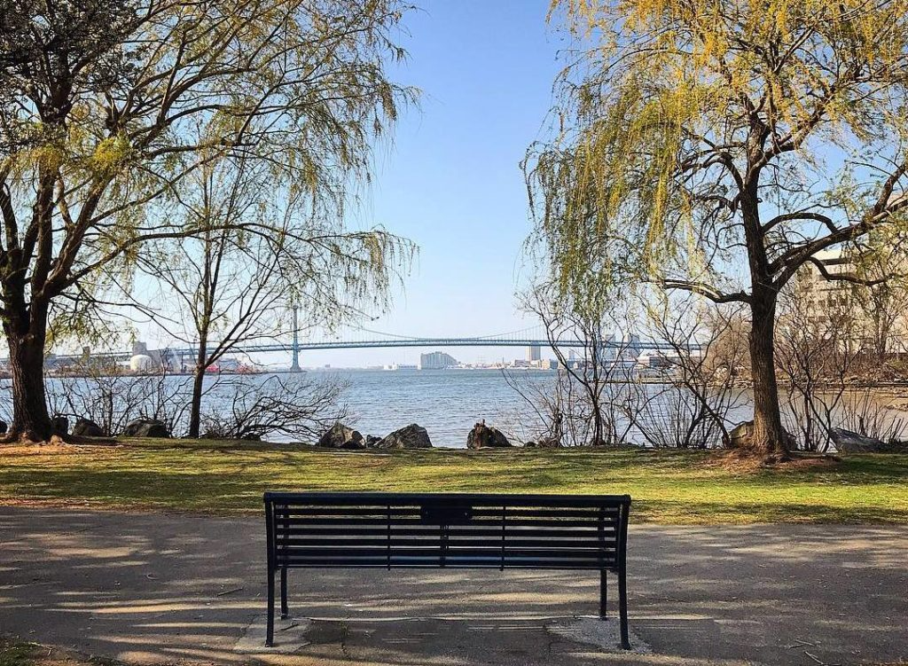 A bench overlooking the Delaware river at Penn Treaty Park in Fishtown