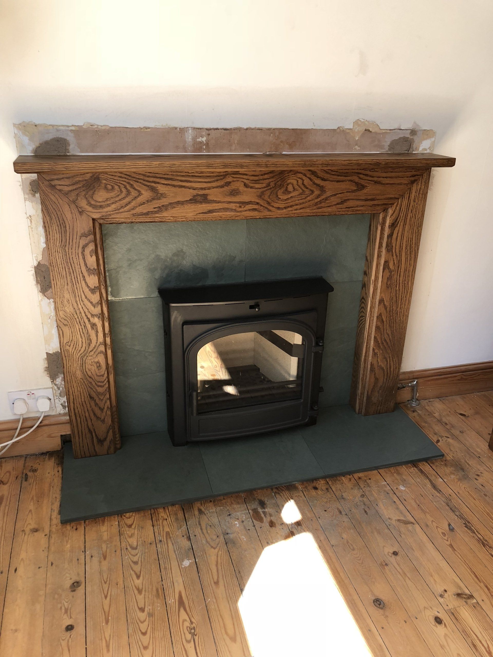 Herald Telford 5 traditional multi fuel stove in wood surround and green slate slips