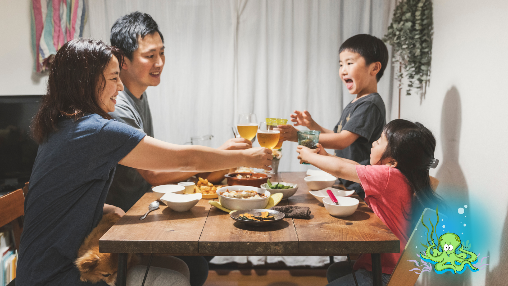 Family cheers around a wooden table. Smiles, drinks raised; food spread out. Home interior, daytime.